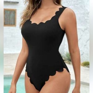 Black one piece bathing suit with tags size NWT